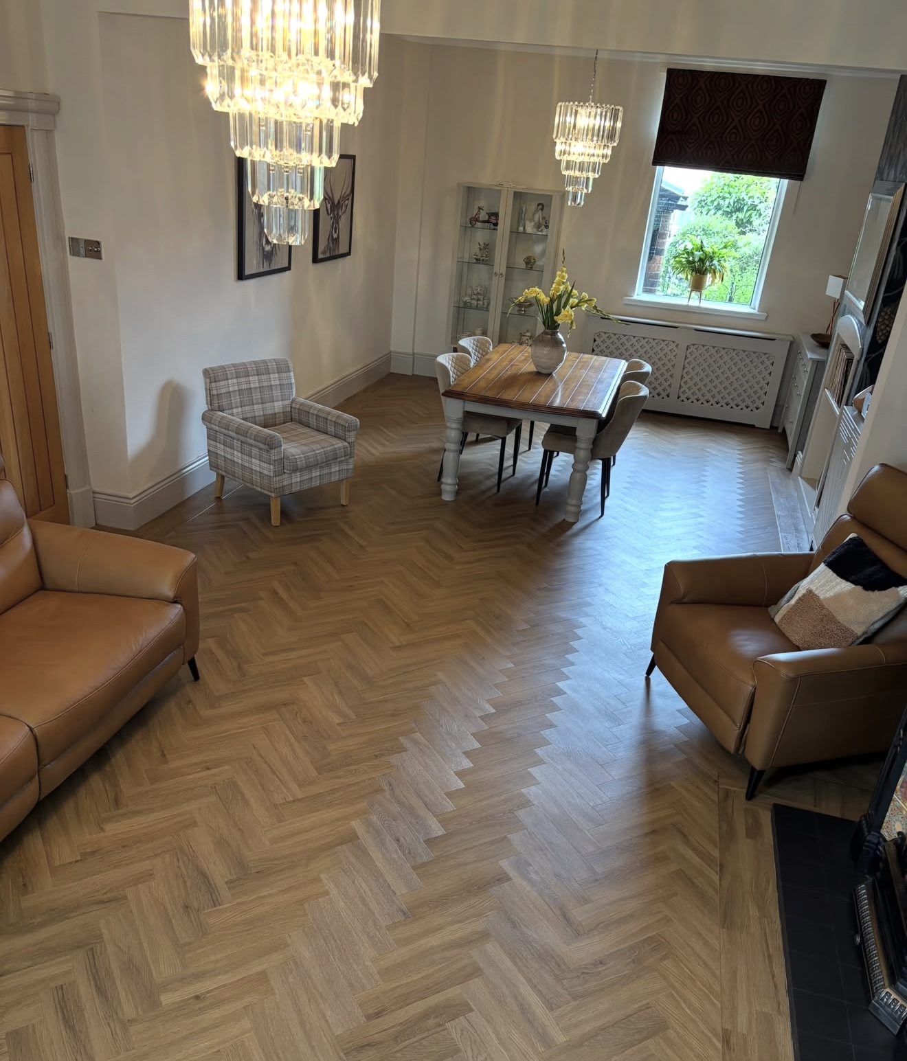 High angle down the lounge diner with a plank border at the hearth
